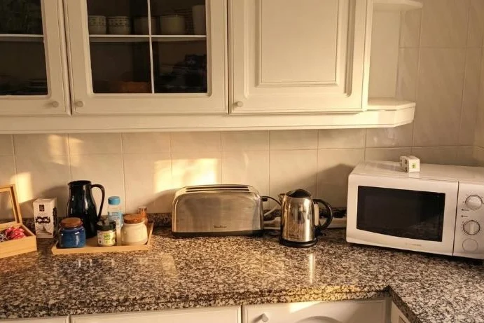 Kitchen with microwave, coffee maker and toaster