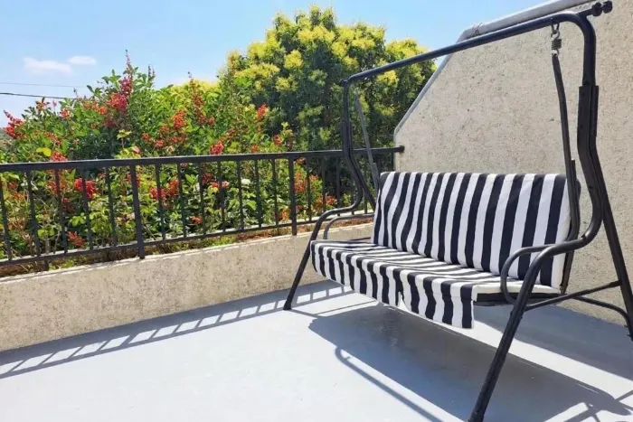 Swing seat in the outdoor area