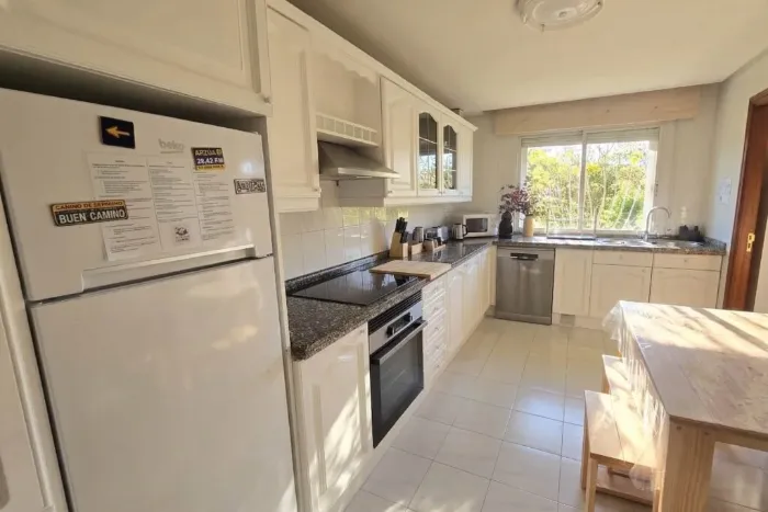 Fully equipped white kitchen