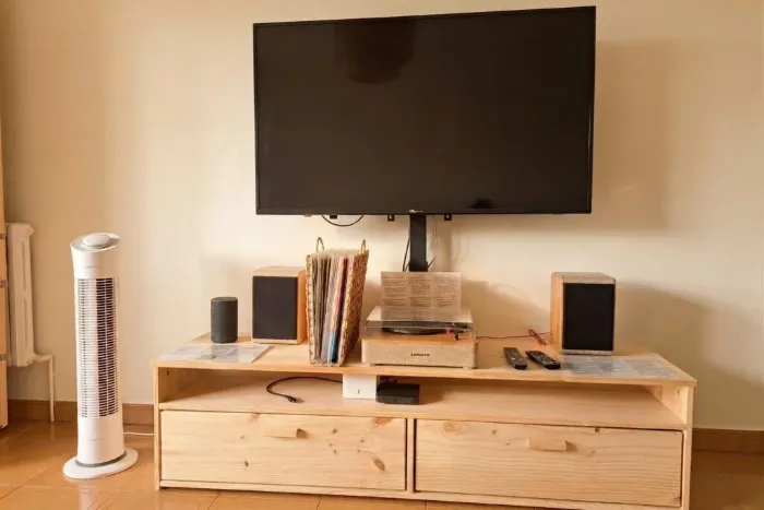 Living room with TV and wooden unit
